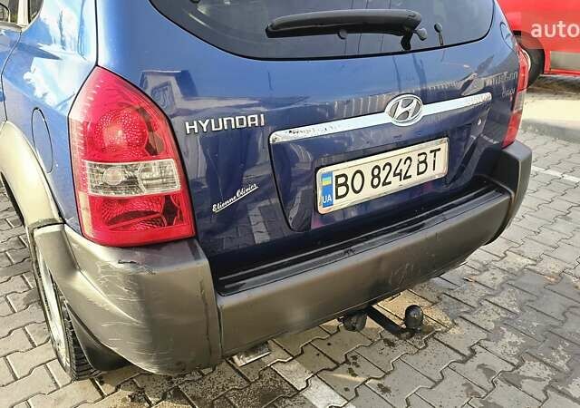 Синий Хендай Туксон, объемом двигателя 1.99 л и пробегом 313 тыс. км за 6000 $, фото 10 на Automoto.ua