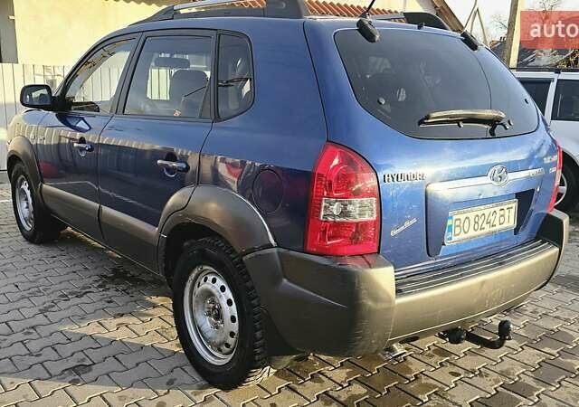 Синий Хендай Туксон, объемом двигателя 1.99 л и пробегом 313 тыс. км за 6000 $, фото 23 на Automoto.ua