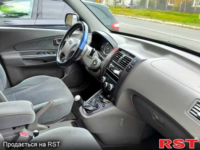Синій Хендай Туксон, об'ємом двигуна 2 л та пробігом 205 тис. км за 7700 $, фото 7 на Automoto.ua