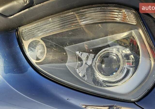 Синий Хендай Туксон, объемом двигателя 1.99 л и пробегом 313 тыс. км за 6000 $, фото 2 на Automoto.ua