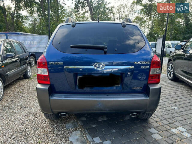 Синій Хендай Туксон, об'ємом двигуна 2 л та пробігом 245 тис. км за 6800 $, фото 4 на Automoto.ua