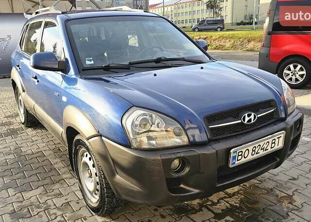 Синий Хендай Туксон, объемом двигателя 1.99 л и пробегом 313 тыс. км за 6000 $, фото 26 на Automoto.ua