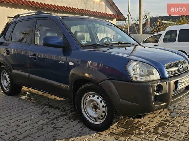 Синий Хендай Туксон, объемом двигателя 1.99 л и пробегом 313 тыс. км за 6000 $, фото 1 на Automoto.ua