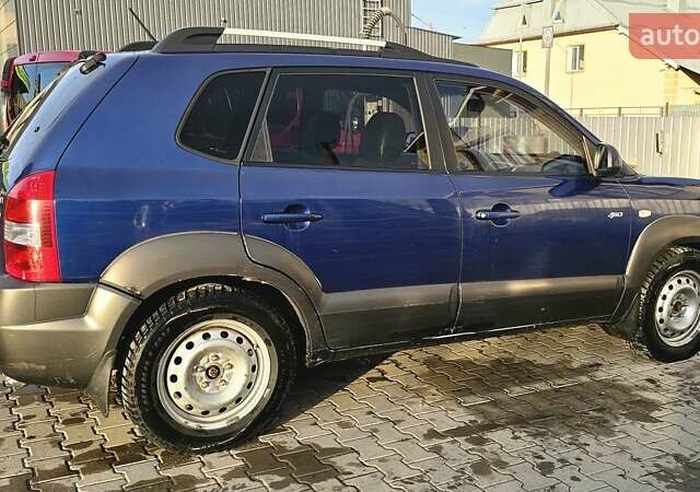 Синий Хендай Туксон, объемом двигателя 1.99 л и пробегом 313 тыс. км за 6000 $, фото 24 на Automoto.ua