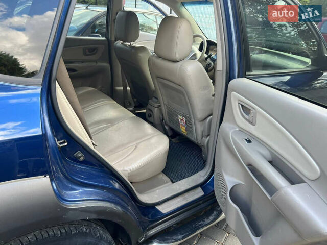 Синій Хендай Туксон, об'ємом двигуна 2 л та пробігом 245 тис. км за 6800 $, фото 13 на Automoto.ua
