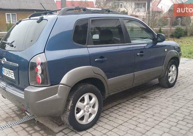 Синий Хендай Туксон, объемом двигателя 2.66 л и пробегом 320 тыс. км за 5500 $, фото 2 на Automoto.ua