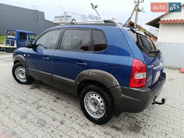 Синий Хендай Туксон, объемом двигателя 2 л и пробегом 314 тыс. км за 6700 $, фото 8 на Automoto.ua