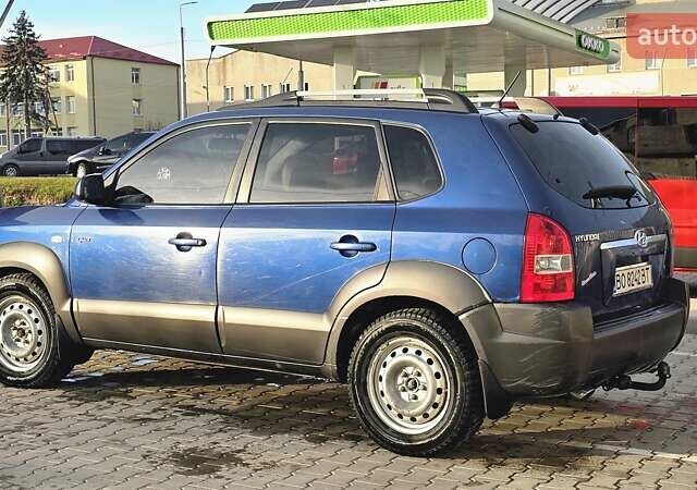Синий Хендай Туксон, объемом двигателя 1.99 л и пробегом 313 тыс. км за 6000 $, фото 8 на Automoto.ua