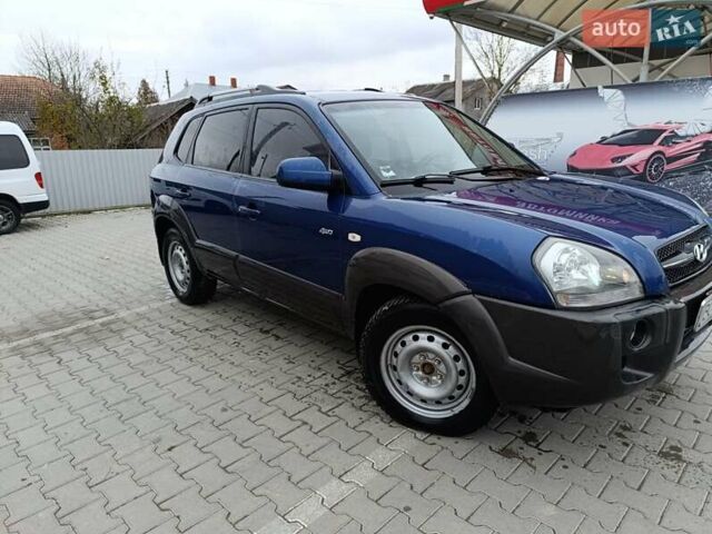Синий Хендай Туксон, объемом двигателя 2 л и пробегом 314 тыс. км за 6700 $, фото 2 на Automoto.ua