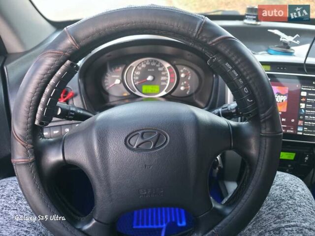 Синий Хендай Туксон, объемом двигателя 1.98 л и пробегом 187 тыс. км за 8400 $, фото 8 на Automoto.ua