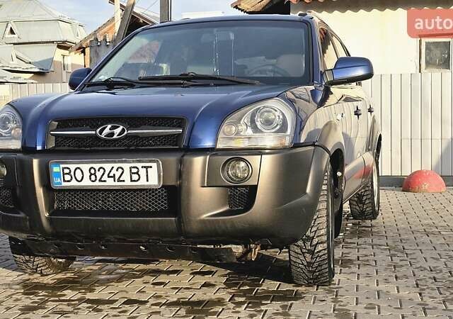 Синий Хендай Туксон, объемом двигателя 1.99 л и пробегом 313 тыс. км за 6000 $, фото 6 на Automoto.ua