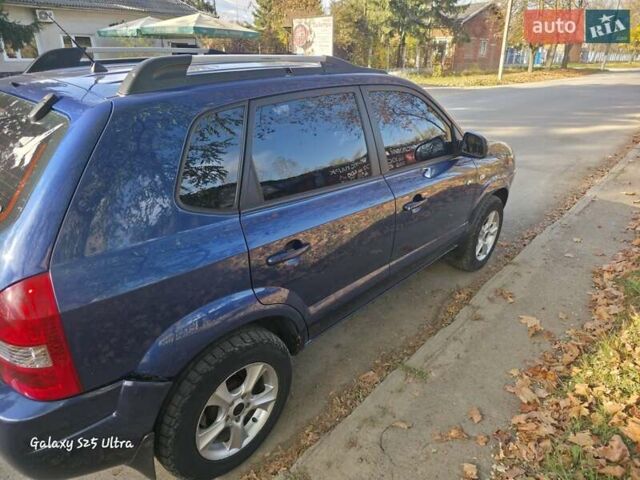 Синий Хендай Туксон, объемом двигателя 1.98 л и пробегом 187 тыс. км за 8400 $, фото 7 на Automoto.ua