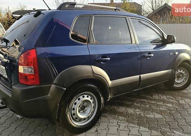 Синий Хендай Туксон, объемом двигателя 1.99 л и пробегом 313 тыс. км за 6000 $, фото 22 на Automoto.ua
