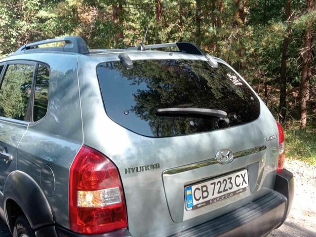 Синій Хендай Туксон, об'ємом двигуна 2 л та пробігом 288 тис. км за 7600 $, фото 4 на Automoto.ua