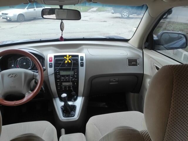 Синий Хендай Туксон, объемом двигателя 2 л и пробегом 225 тыс. км за 7300 $, фото 8 на Automoto.ua