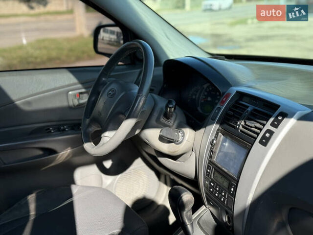 Синій Хендай Туксон, об'ємом двигуна 2 л та пробігом 317 тис. км за 6990 $, фото 6 на Automoto.ua