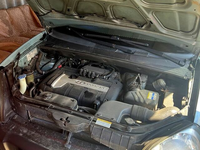 Синий Хендай Туксон, объемом двигателя 2 л и пробегом 280 тыс. км за 7500 $, фото 9 на Automoto.ua