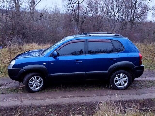 Синий Хендай Туксон, объемом двигателя 2 л и пробегом 219 тыс. км за 8400 $, фото 5 на Automoto.ua