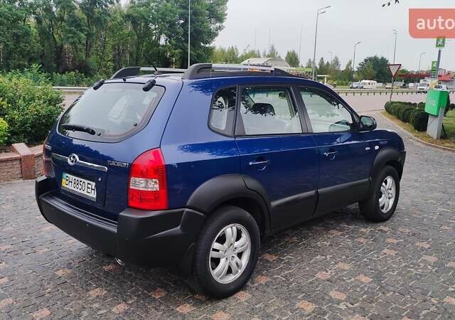 Синій Хендай Туксон, об'ємом двигуна 2 л та пробігом 225 тис. км за 8200 $, фото 4 на Automoto.ua