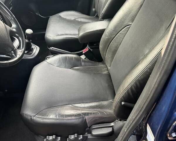 Синій Хендай Туксон, об'ємом двигуна 1.98 л та пробігом 139 тис. км за 7690 $, фото 9 на Automoto.ua