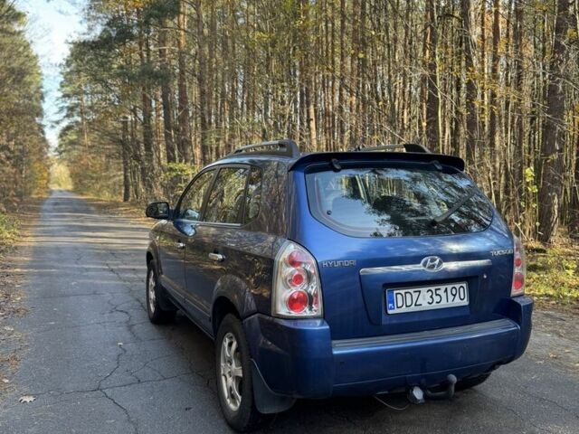 Синій Хендай Туксон, об'ємом двигуна 2 л та пробігом 272 тис. км за 3100 $, фото 4 на Automoto.ua