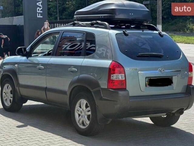 Синий Хендай Туксон, объемом двигателя 2 л и пробегом 316 тыс. км за 8500 $, фото 3 на Automoto.ua