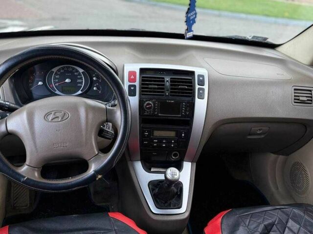 Синий Хендай Туксон, объемом двигателя 2 л и пробегом 262 тыс. км за 4450 $, фото 7 на Automoto.ua