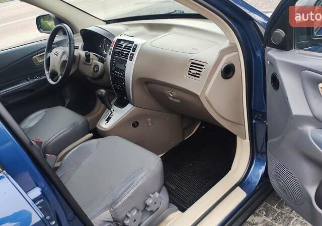 Синій Хендай Туксон, об'ємом двигуна 2 л та пробігом 225 тис. км за 8200 $, фото 11 на Automoto.ua