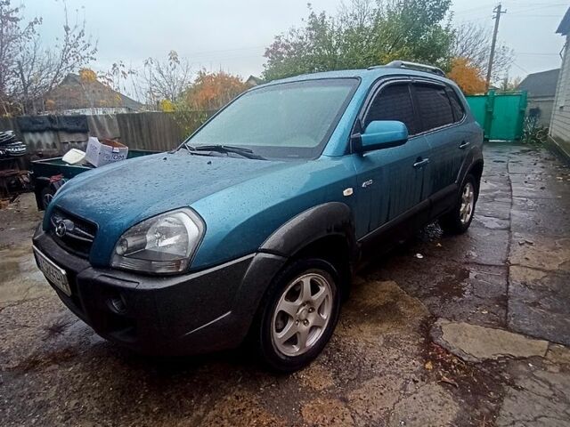 Синий Хендай Туксон, объемом двигателя 2 л и пробегом 210 тыс. км за 7550 $, фото 1 на Automoto.ua