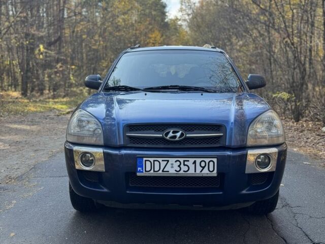 Синий Хендай Туксон, объемом двигателя 2 л и пробегом 291 тыс. км за 3400 $, фото 2 на Automoto.ua