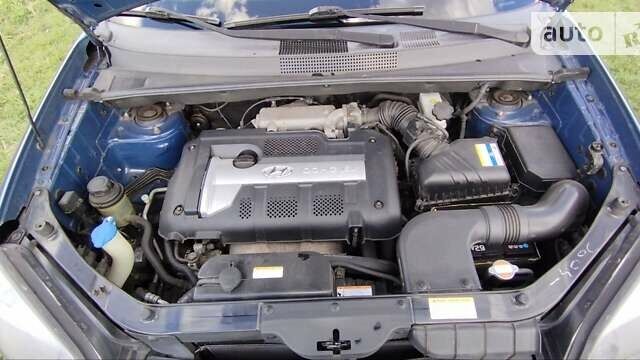 Синий Хендай Туксон, объемом двигателя 1.98 л и пробегом 145 тыс. км за 7400 $, фото 10 на Automoto.ua