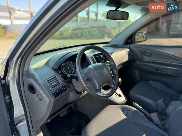 Синій Хендай Туксон, об'ємом двигуна 2 л та пробігом 317 тис. км за 6990 $, фото 7 на Automoto.ua