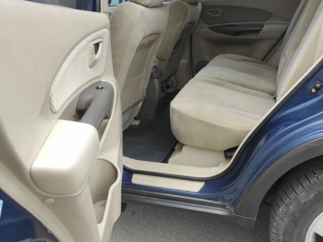 Синий Хендай Туксон, объемом двигателя 2 л и пробегом 225 тыс. км за 7300 $, фото 6 на Automoto.ua