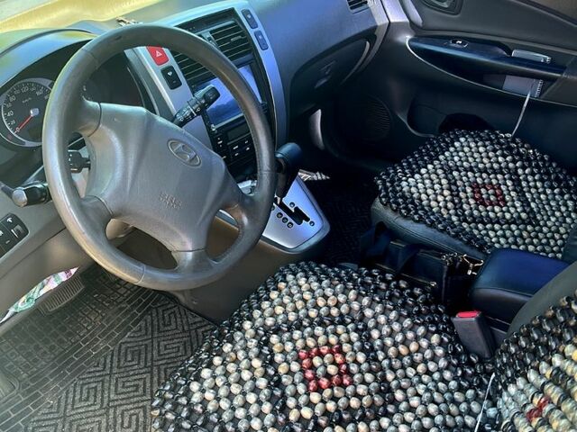 Синий Хендай Туксон, объемом двигателя 2 л и пробегом 280 тыс. км за 7500 $, фото 5 на Automoto.ua