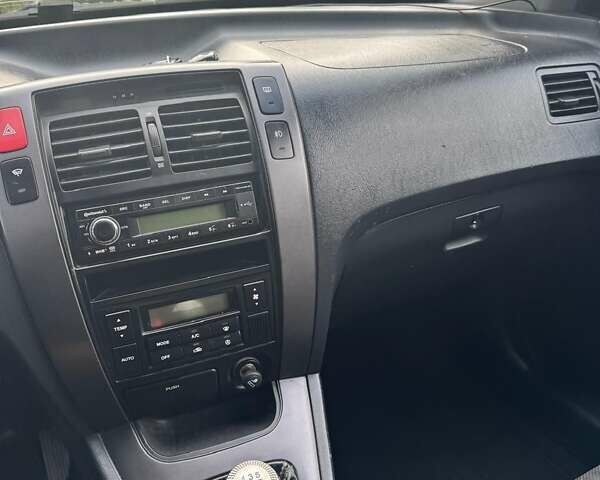Синій Хендай Туксон, об'ємом двигуна 1.98 л та пробігом 139 тис. км за 7690 $, фото 6 на Automoto.ua