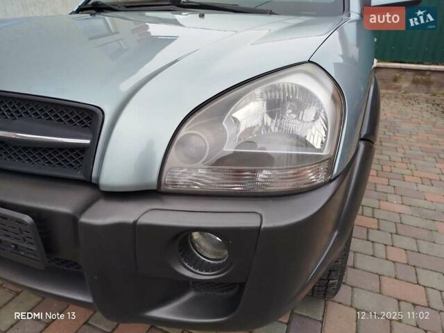 Синий Хендай Туксон, объемом двигателя 2 л и пробегом 213 тыс. км за 8900 $, фото 39 на Automoto.ua