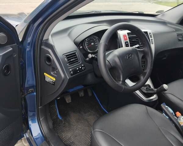 Синий Хендай Туксон, объемом двигателя 1.98 л и пробегом 201 тыс. км за 9400 $, фото 11 на Automoto.ua