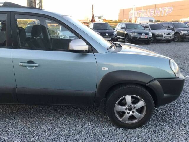 Синий Хендай Туксон, объемом двигателя 2 л и пробегом 207 тыс. км за 6890 $, фото 15 на Automoto.ua