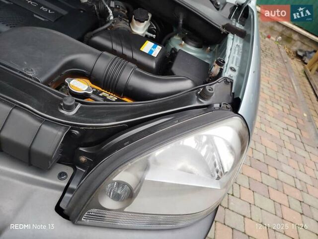 Синий Хендай Туксон, объемом двигателя 2 л и пробегом 213 тыс. км за 8900 $, фото 91 на Automoto.ua