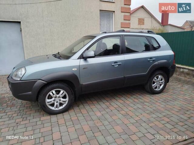 Синий Хендай Туксон, объемом двигателя 2 л и пробегом 213 тыс. км за 8900 $, фото 1 на Automoto.ua