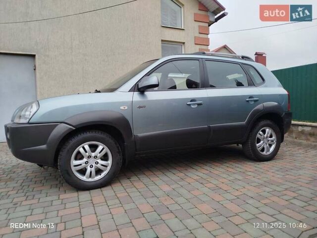 Синий Хендай Туксон, объемом двигателя 2 л и пробегом 213 тыс. км за 8900 $, фото 2 на Automoto.ua