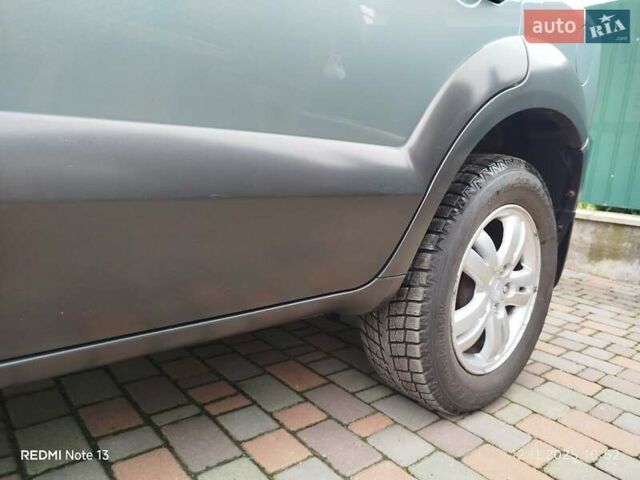 Синий Хендай Туксон, объемом двигателя 2 л и пробегом 213 тыс. км за 8900 $, фото 22 на Automoto.ua