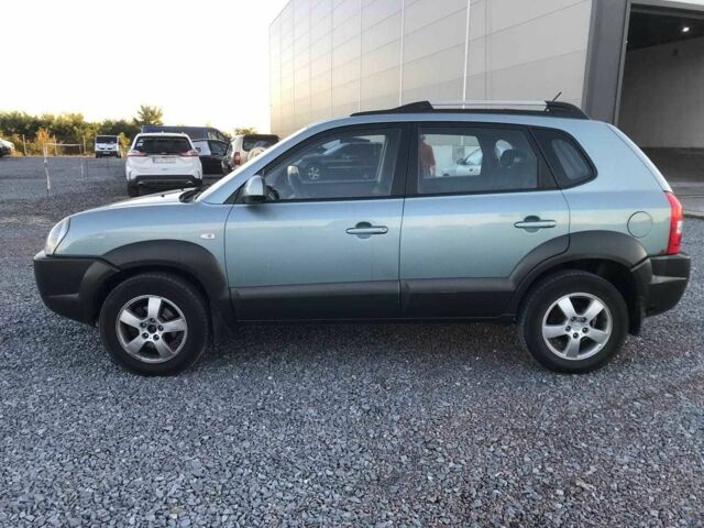 Синий Хендай Туксон, объемом двигателя 2 л и пробегом 207 тыс. км за 6890 $, фото 1 на Automoto.ua