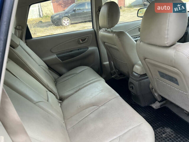Синий Хендай Туксон, объемом двигателя 1.98 л и пробегом 210 тыс. км за 4500 $, фото 13 на Automoto.ua