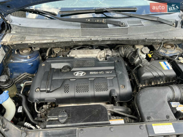 Синий Хендай Туксон, объемом двигателя 1.98 л и пробегом 210 тыс. км за 4500 $, фото 15 на Automoto.ua