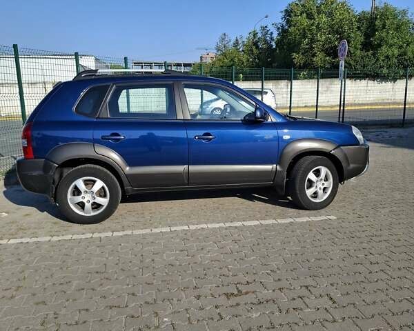 Синій Хендай Туксон, об'ємом двигуна 2 л та пробігом 158 тис. км за 8500 $, фото 4 на Automoto.ua