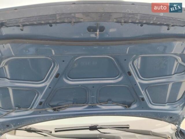Синий Хендай Туксон, объемом двигателя 1.98 л и пробегом 201 тыс. км за 9400 $, фото 3 на Automoto.ua