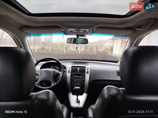 Синий Хендай Туксон, объемом двигателя 2 л и пробегом 213 тыс. км за 8900 $, фото 58 на Automoto.ua