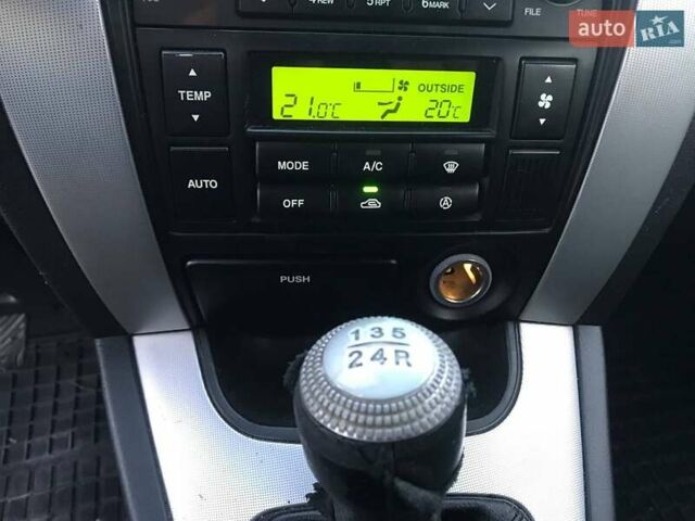 Синий Хендай Туксон, объемом двигателя 2 л и пробегом 207 тыс. км за 7990 $, фото 4 на Automoto.ua