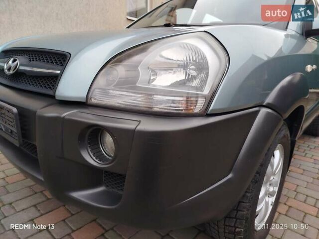 Синий Хендай Туксон, объемом двигателя 2 л и пробегом 213 тыс. км за 8900 $, фото 18 на Automoto.ua